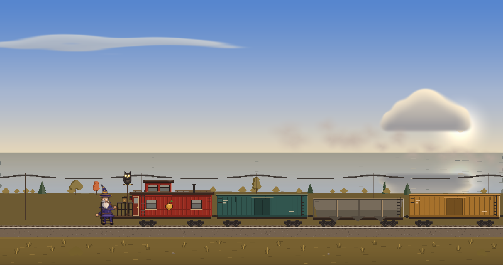 The train beside a calm sea under a hazy sun.