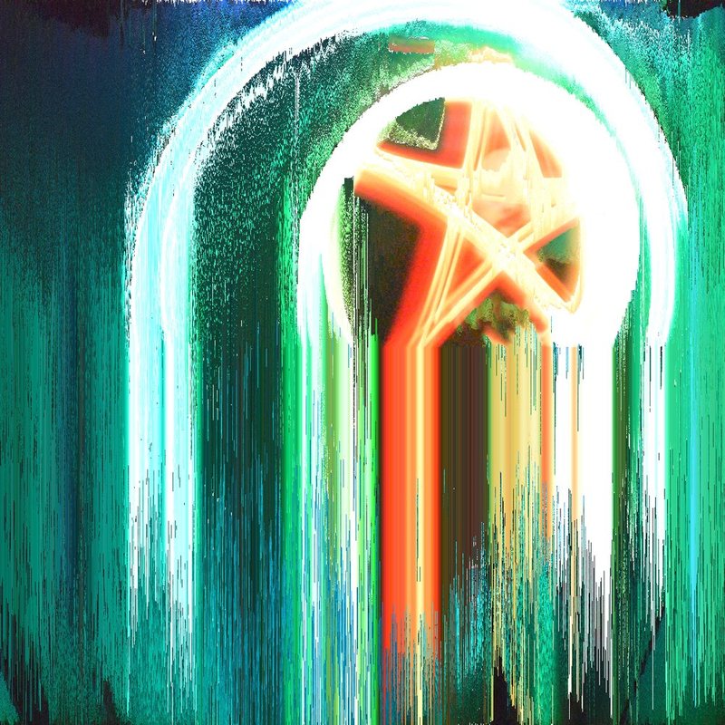 The light painting with its colours dripping straight down in long white, green and orange streaks.