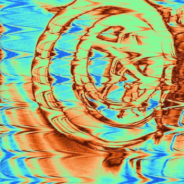 The same photograph turned to rust and pale blue ripples, like sand dunes seen from above, with the rings and star still readable.